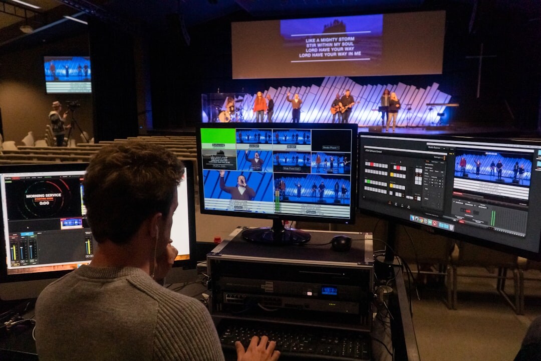Live TV production control room with multiple screens