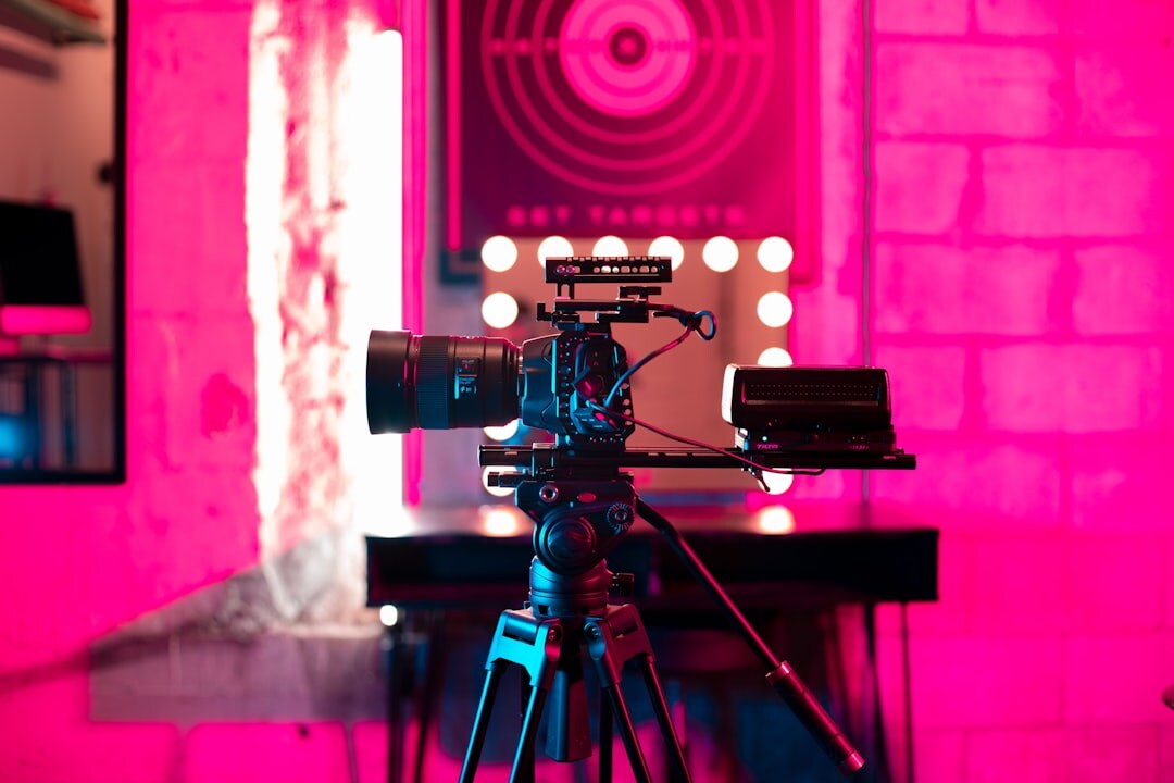 Professional video camera on tripod in studio